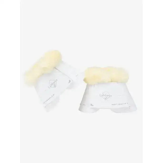 White leather lemieux motionflex reach boots with strong lightweight shell and soft pale yellow fleece trim