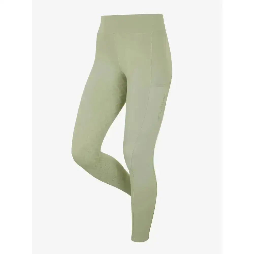 A pair of sage green lemieux naomi pull on breech fern leggings with a high waist and tapered lower leg detailing
