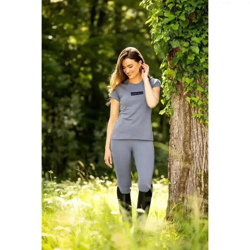 Gray short-sleeved t-shirt with a small black logo perfect for pairing with lemieux naomi pull breech jay blue and a supportive elasticated waistband