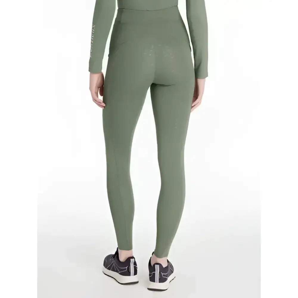Olive green high-waisted lemieux naomi pull leggings with sleek fit and subtle side seam detailing