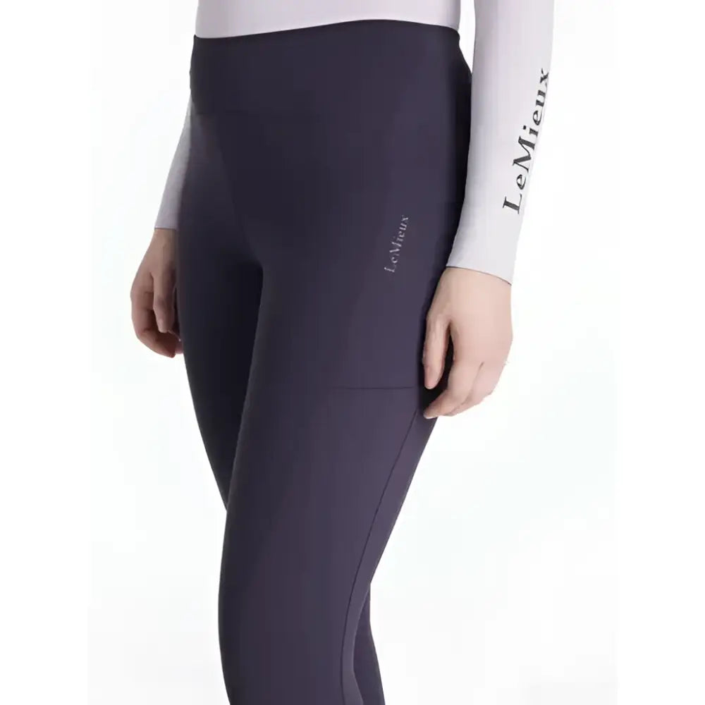 Dark purple lemieux natalie brushed riding leggings with subtle seam detail and branded thigh logo