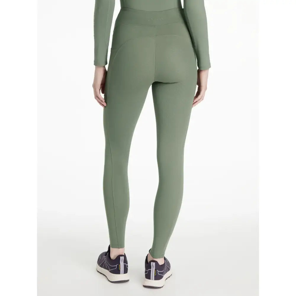 Olive green high waisted seamless leggings with a form fitting design from lemieux natalie brushed pull on rosemary