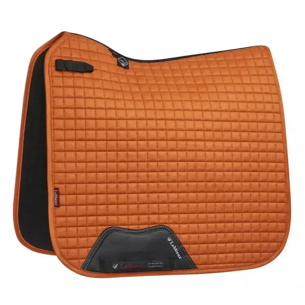 Orange lemieux paprika prosport quilted saddle pad with black trim and suede dressage square front patch