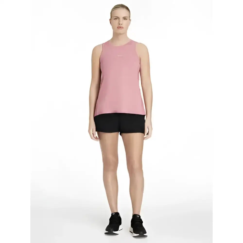 A soft pink sleeveless athletic top with subtle logo paired with lemieux penny shorts black for shorts layer look