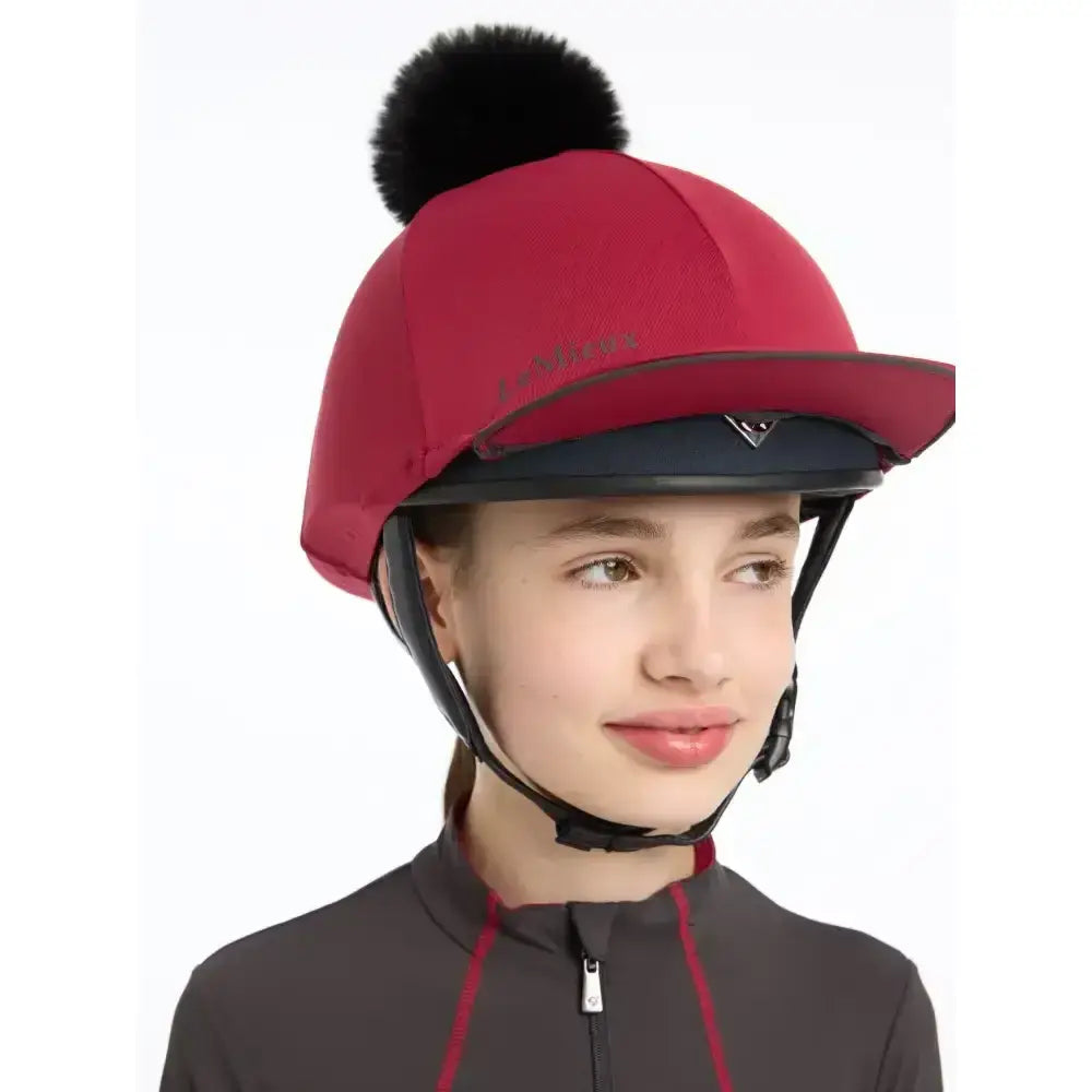 Red lemieux pippa hat silk ember with black faux fur pom pom equestrian helmet cover