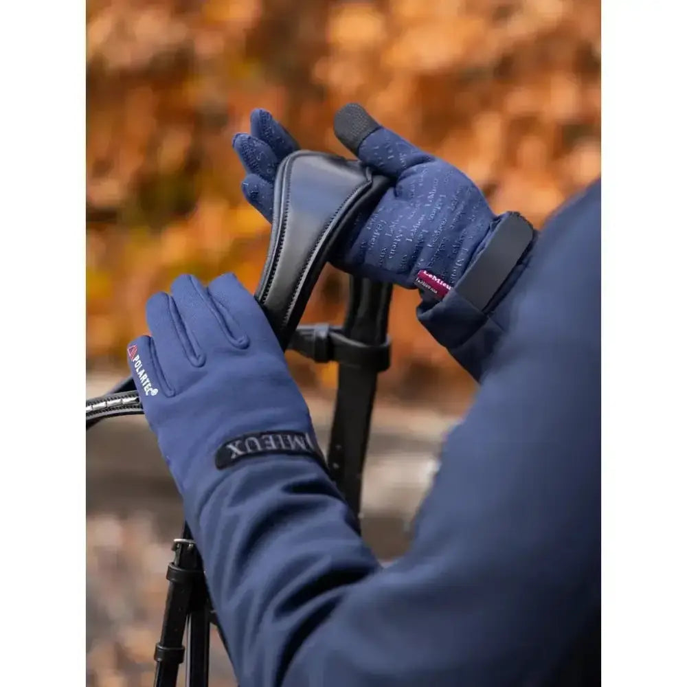 Navy blue lemieux polartec gloves with black leather accents and subtle texture shown from the back side