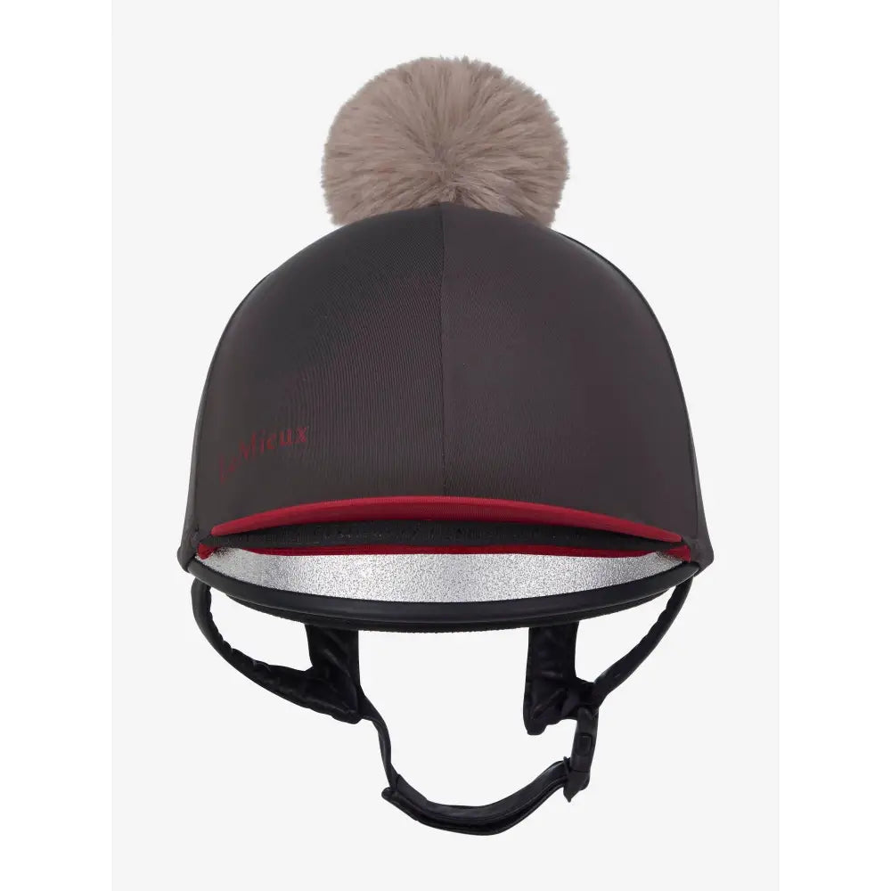 Black lemieux pom hat silk cinder made with silky smooth four-way fabric featuring beige faux fur pom-pom and red trim