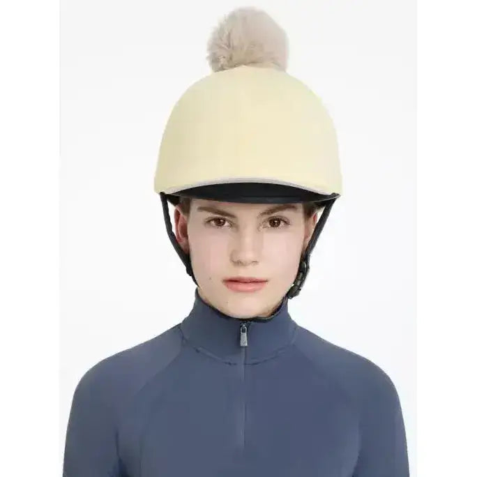 Cream-colored lemieux pom hat fleece helmet cover with a fluffy beige pom-pom in silk mimosa stone color