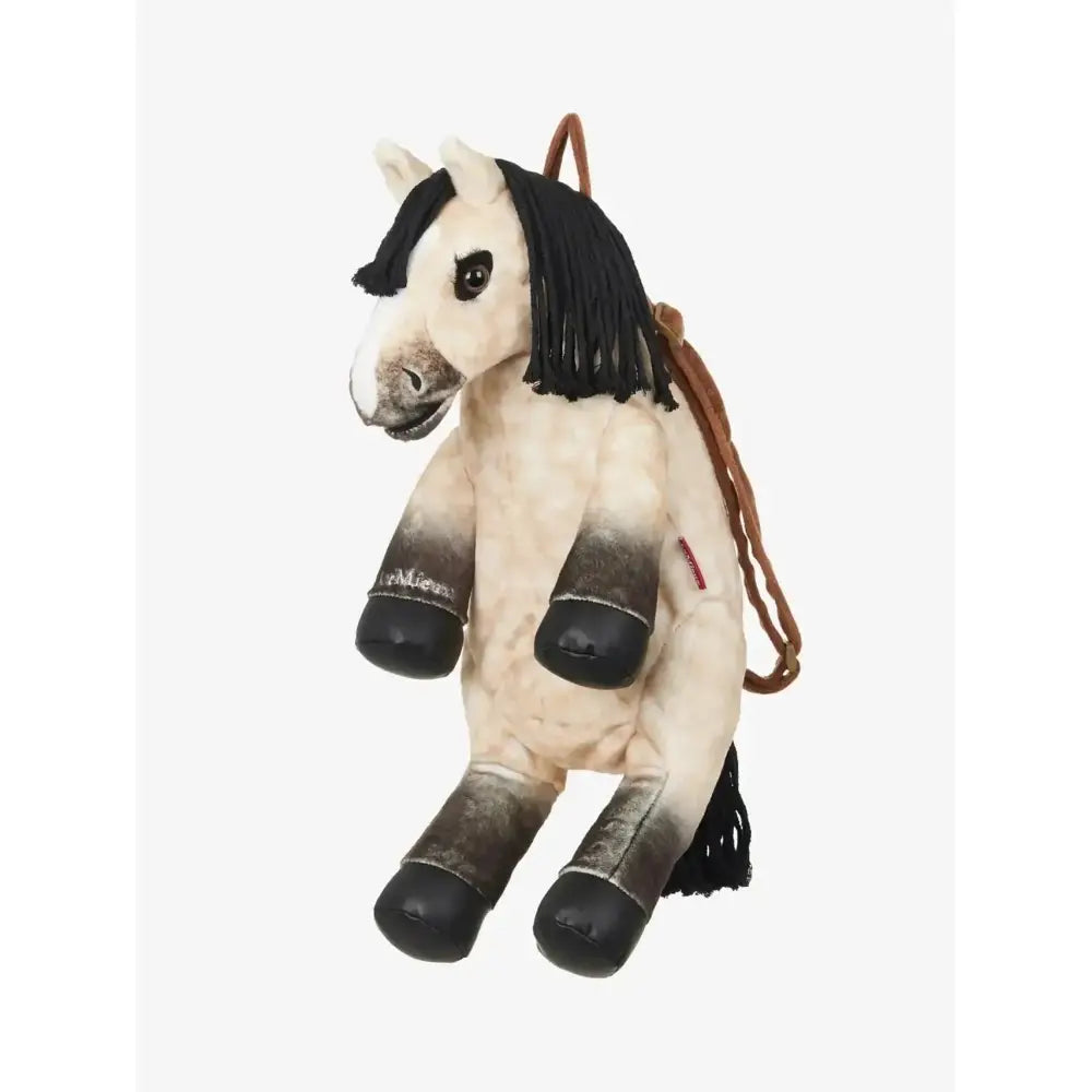 A plush lemieux pony bag dream backpack with cream black gradient body brown leather straps and black hoof feet