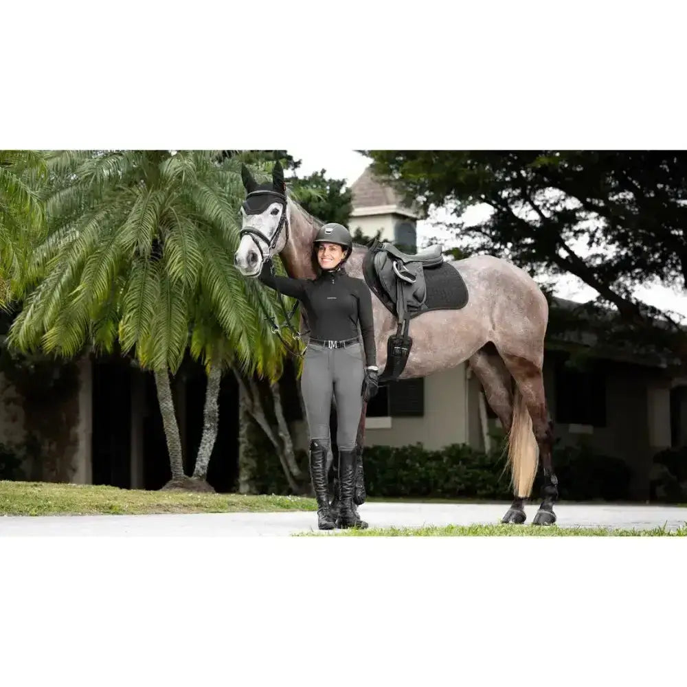Black riding helmet with sleek matte finish and subtle ventilation slots for lemieux prosorb plain close contact square black