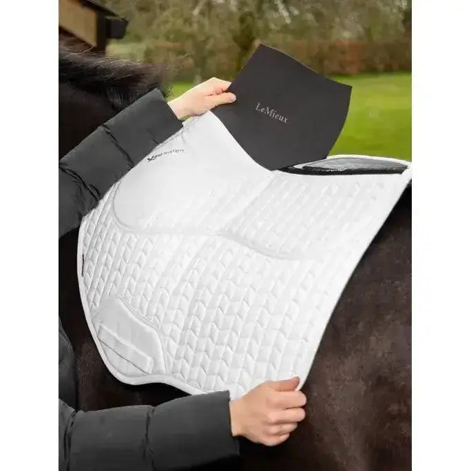 White quilted lemieux prosorb plain close contact square saddle pad with black branded cover expertly designed prosorb