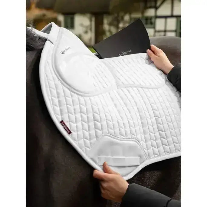 White quilted lemieux prosorb plain close contact square saddle pad with padded contours and branded logo