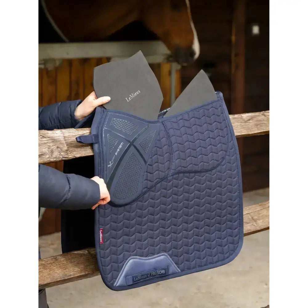 Navy blue quilted lemieux prosorb plain dressage square navy with updated foam support and gray inner lining