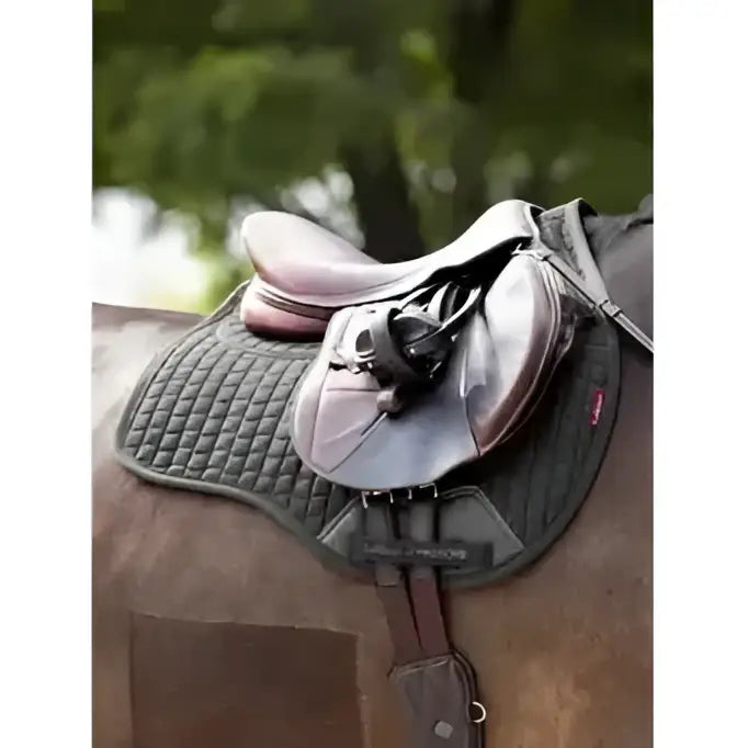 Lelieux prosorb sleek dark gray quilted saddle pad with updated foam support and brown leather straps for horse riding