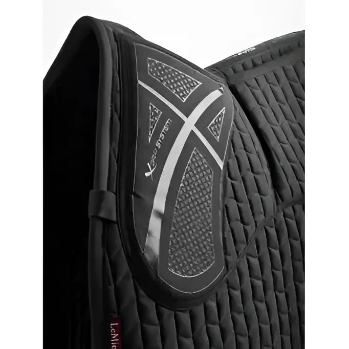 Black lemieux prosorb quilted saddle pad with silver reflective x design and updated foam support for gp use