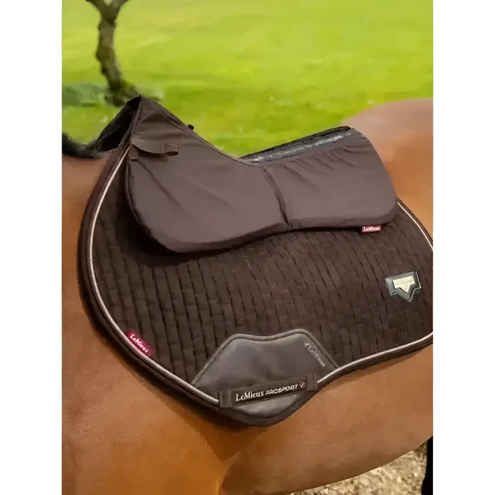 Black quilted lemieux prosorb plain pocket half pad with silver stitching and padded flap for expert support