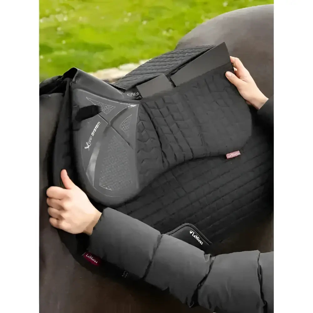 Black lemieux prosorb plain pocket quilted half pad with textured contoured design and subtle side branding