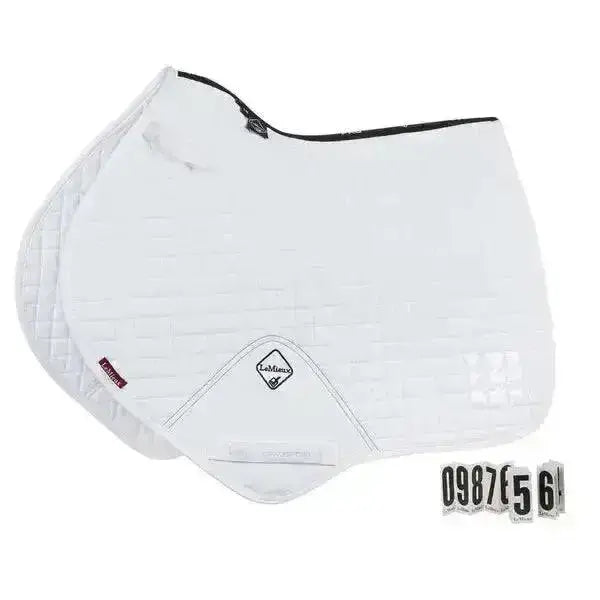 White quilted cotton close contact saddle pad with black trim and diamond shaped lemieux prosport cotton logo