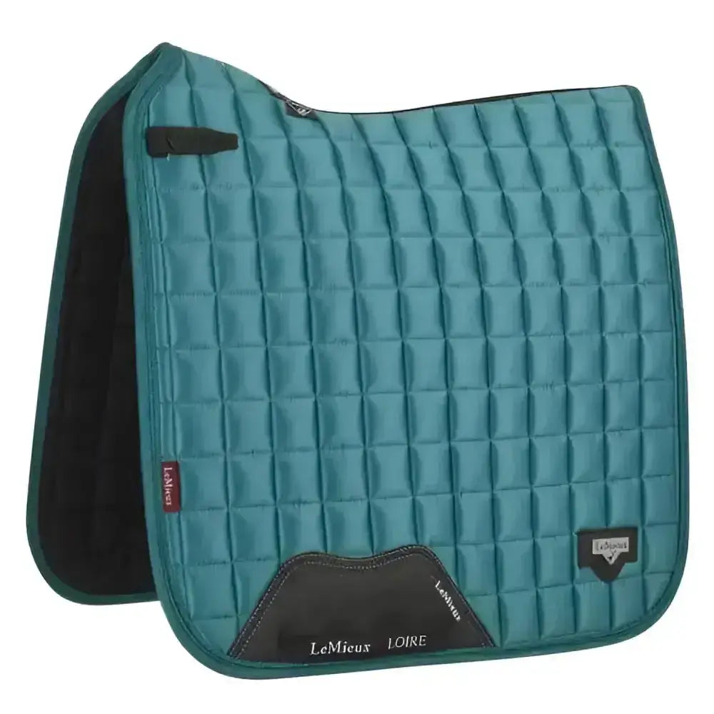 Teal quilted lemieux prosport loire classic dressage square peacock saddle pad with black trim and branding