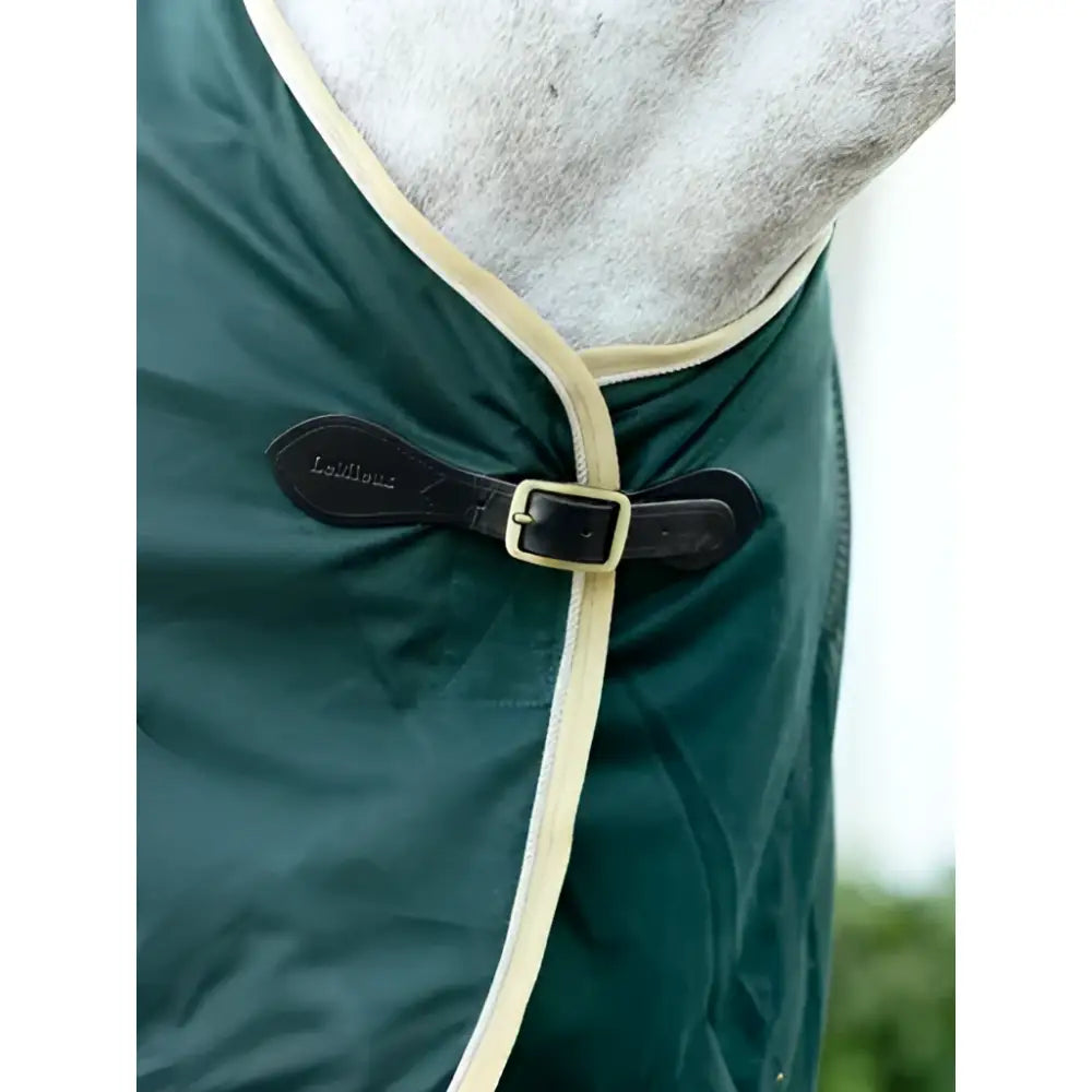Dark green horse rug lemieux scrim green with cream trim and black leather buckle featuring lemieux logo