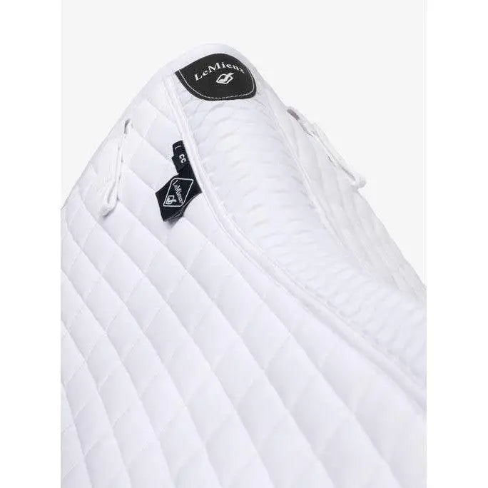White quilted lemieux self-cool close contact square arctic white sleeping bag with ribbed stitching and black brand tags