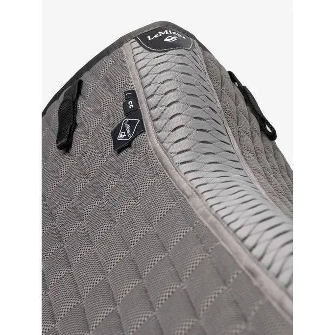 Gray quilted lemieux self-cool close contact square polar grey saddle pad with breathable mesh and black zipper pulls