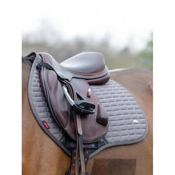 Gray quilted lemieux self-cool close contact saddle pad with black trim and red brand tag in square polar grey