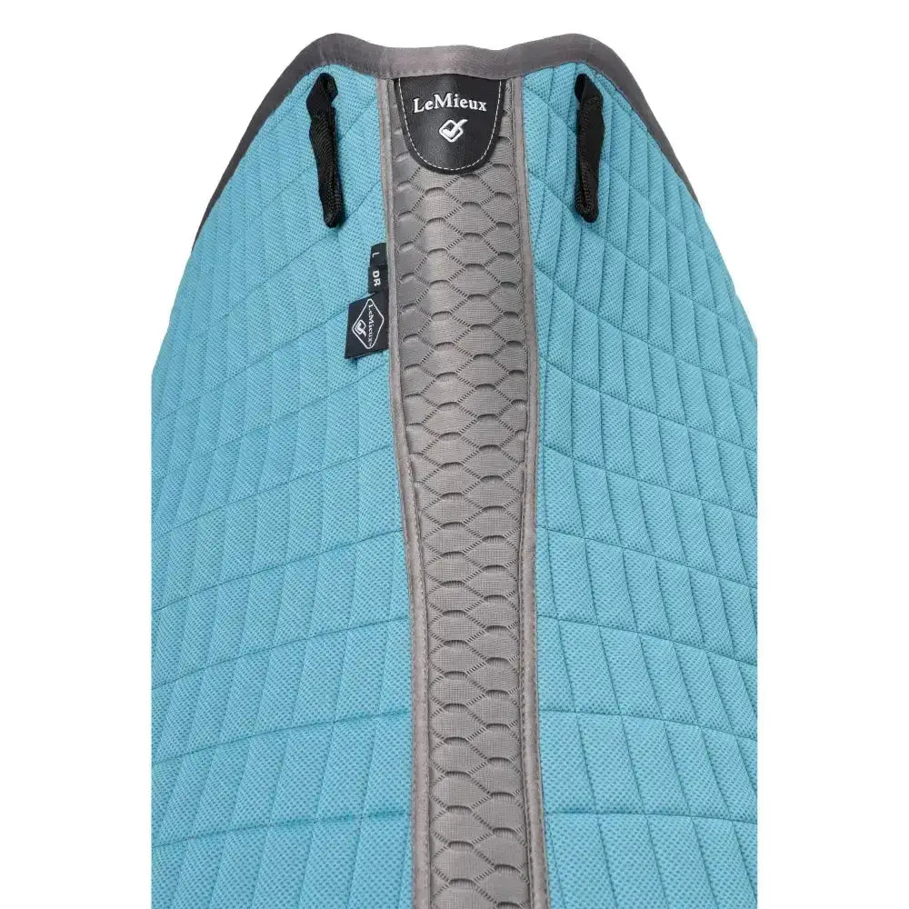 Light blue lemieux self-cool dressage square cool blue saddle pad with quilted design gray strip and black leather branding
