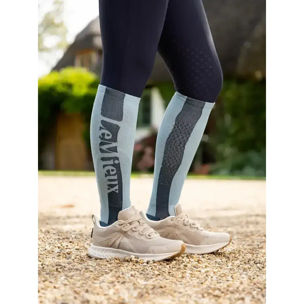 Light blue and dark gray lemieux silicone sock glacier with textured pattern and bold newbie branding for technical performance socks