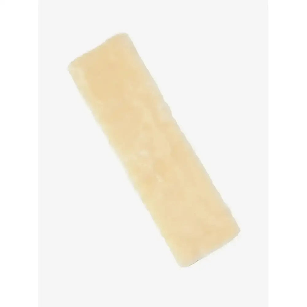 A pale yellow cushioned faux lambswool rectangular rug with soft plush texture for lemieux simuwool dressage girth sleeve natural