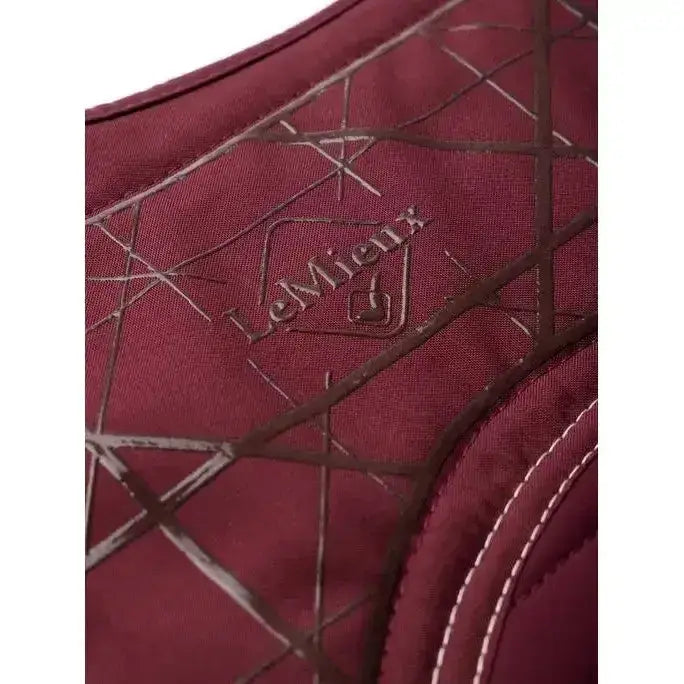 Maroon lemieux soft shell quilted vest with subtle geometric pattern and white stitching close contact square burgundy