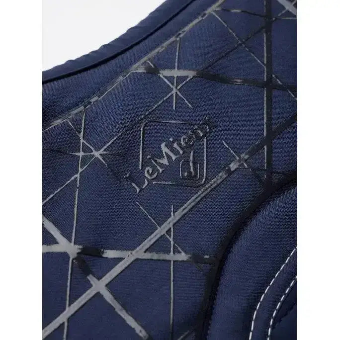 Dark blue quilted lemieux soft shell horse vest with geometric pattern and close contact square anti slip design