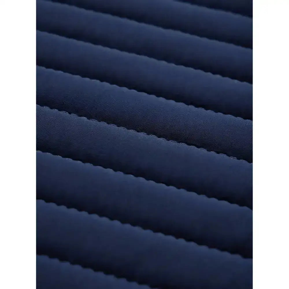 Dark blue ribbed fabric with soft plush texture on lemieux soft shell anti slip close contact square saddle pad