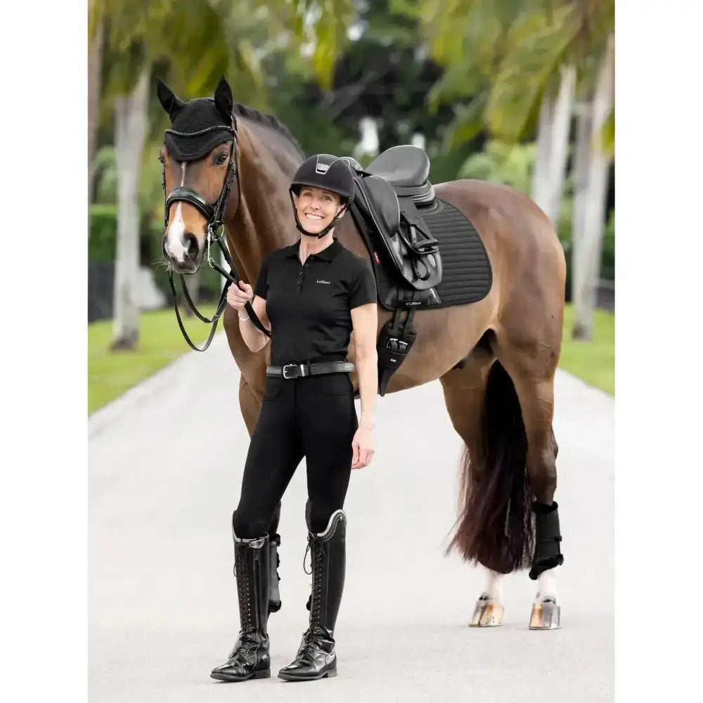 Black lemieux soft shell riding helmet with sleek glossy finish and subtle branding for anti slip dressage use