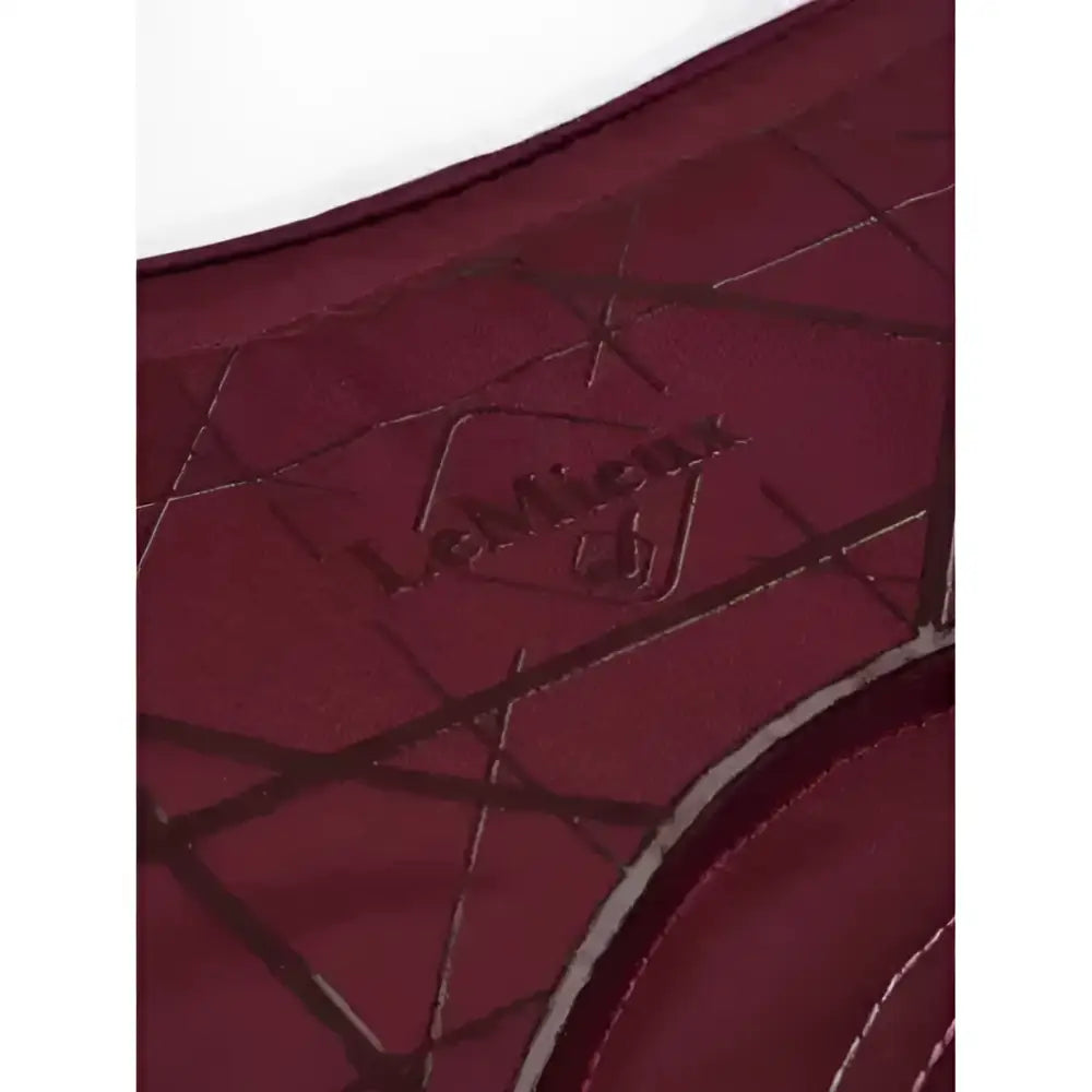 A maroon leather wallet with quilted diamond pattern and embossed logo perfect for lemieux soft shell anti slip use