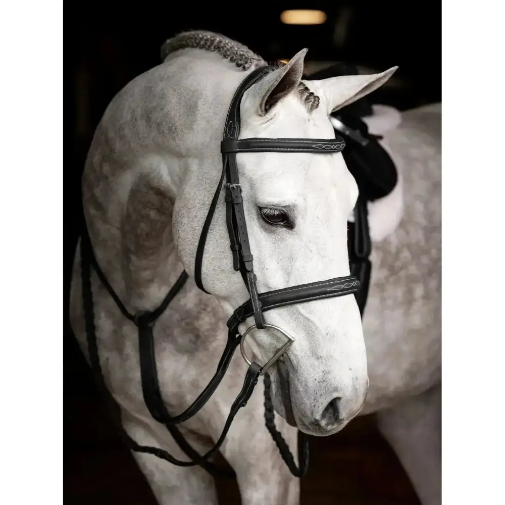 Black leather lemieux stitched hunter bridle with subtle white stitching and laced reins black silver decorative patterns