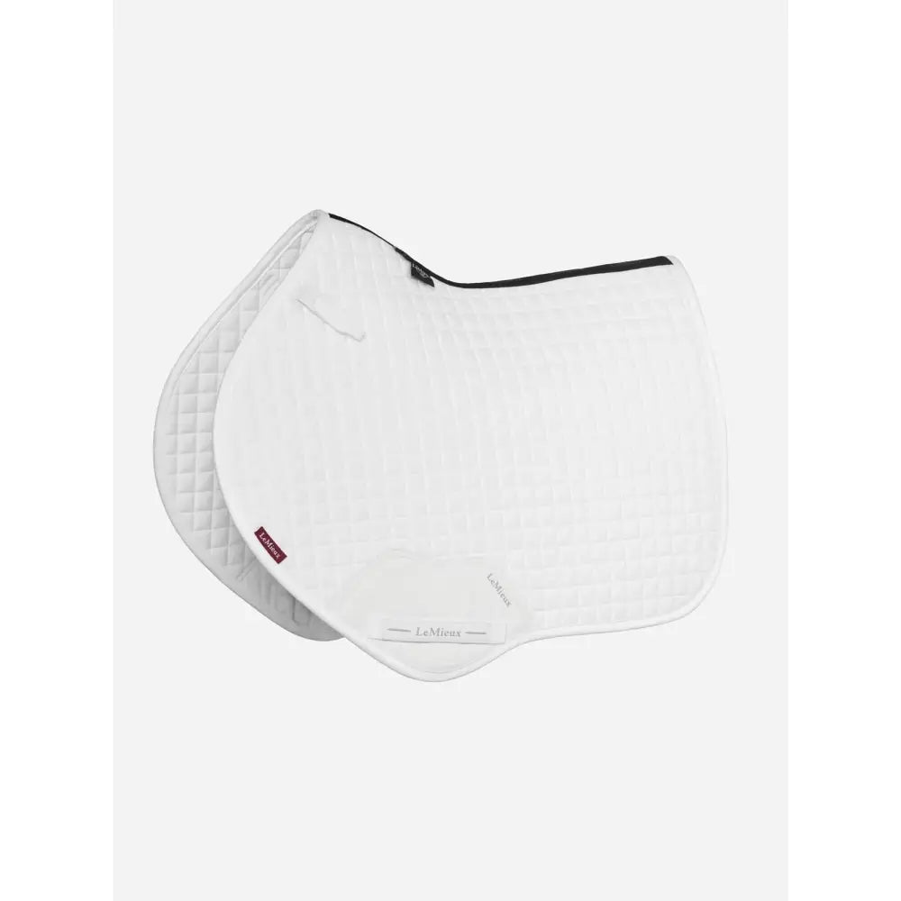 White quilted lemieux suede close contact square white saddle pad with black trim and subtle diamond pattern