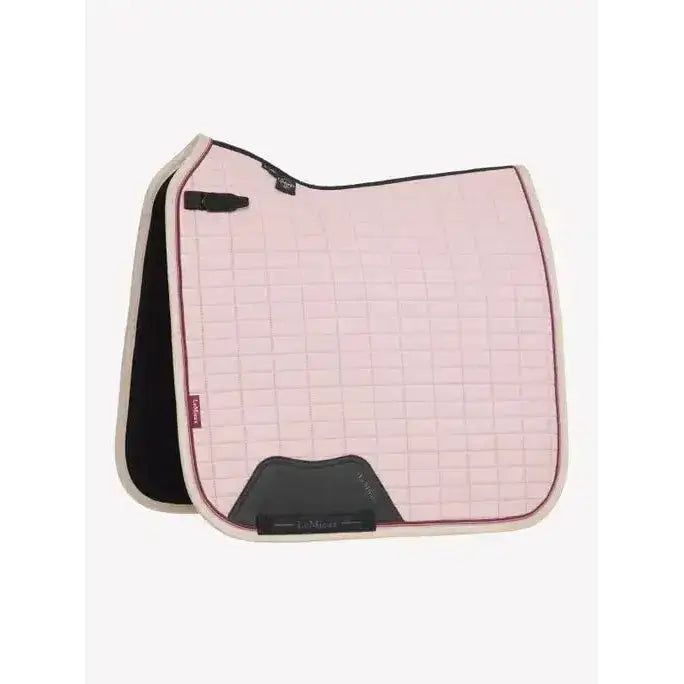 Pink lemieux suede dressage square blossom saddle pad with black trim and dark gray reinforced front panel
