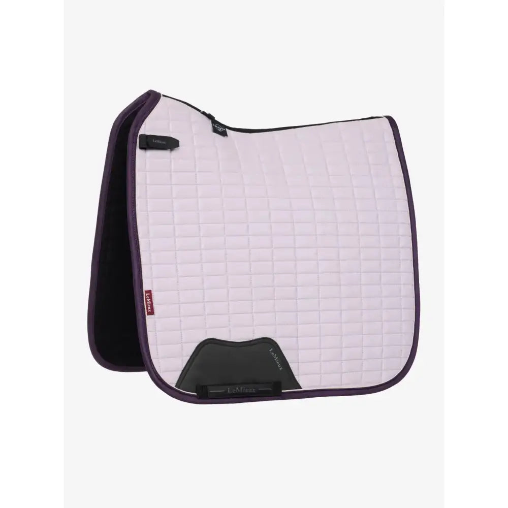 Lavender quilted lemieux suede dressage saddle pad with dark purple border black accents and lambs logo in lilac saddle pad style
