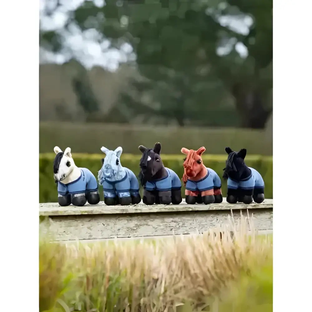 Five lemieux tiny pony dream miniature horses wearing blue riding jackets with black accents and detailed faces