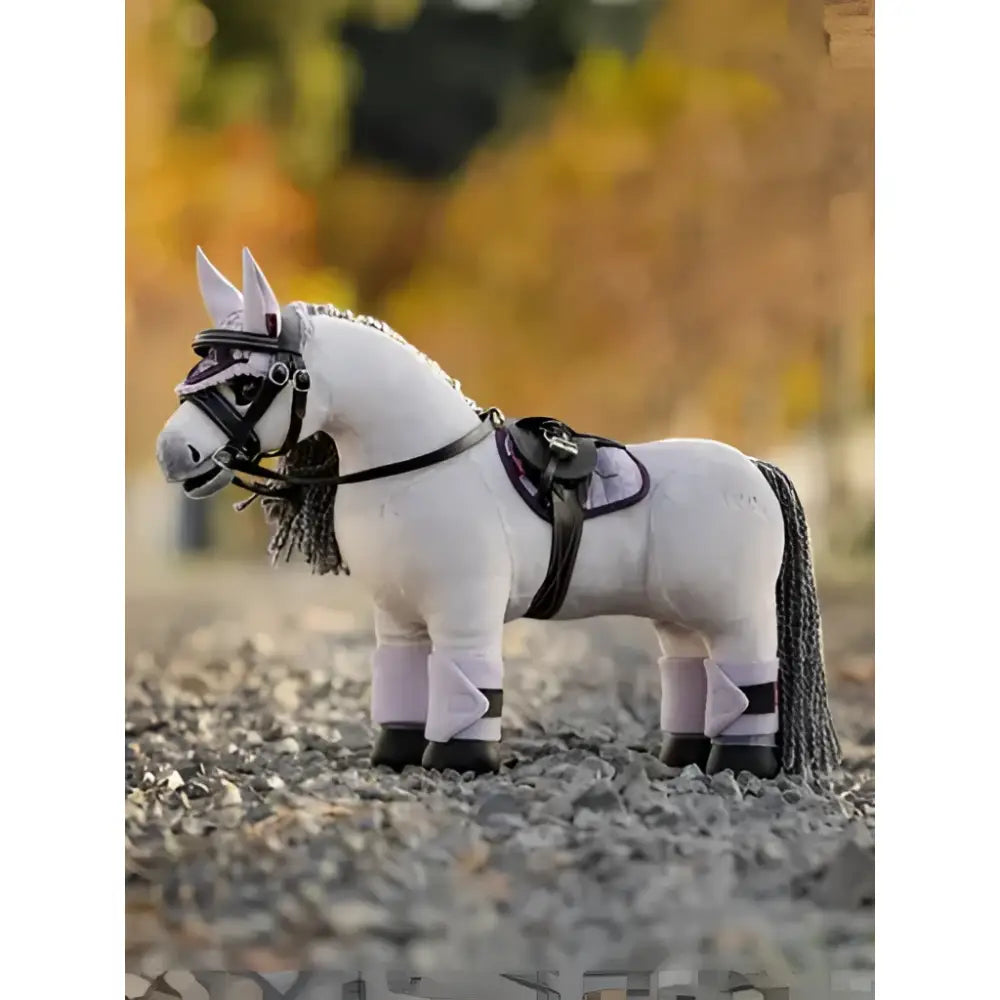 White plush lemieux toy pony blanca with black bridle saddle and leg wraps perfect for play and decor