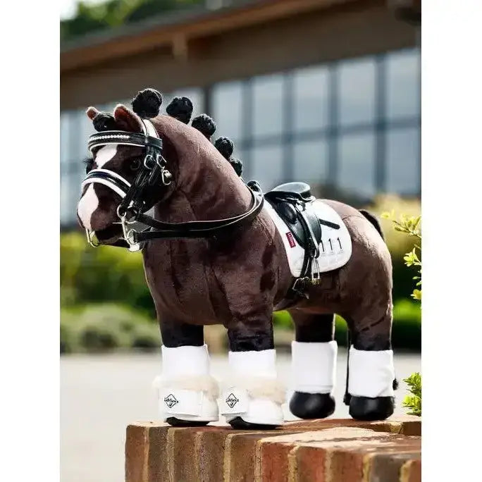 Brown plush lemieux toy pony with black mane, white markings, detailed saddle, bridle, and toy pony dressage reach boot white