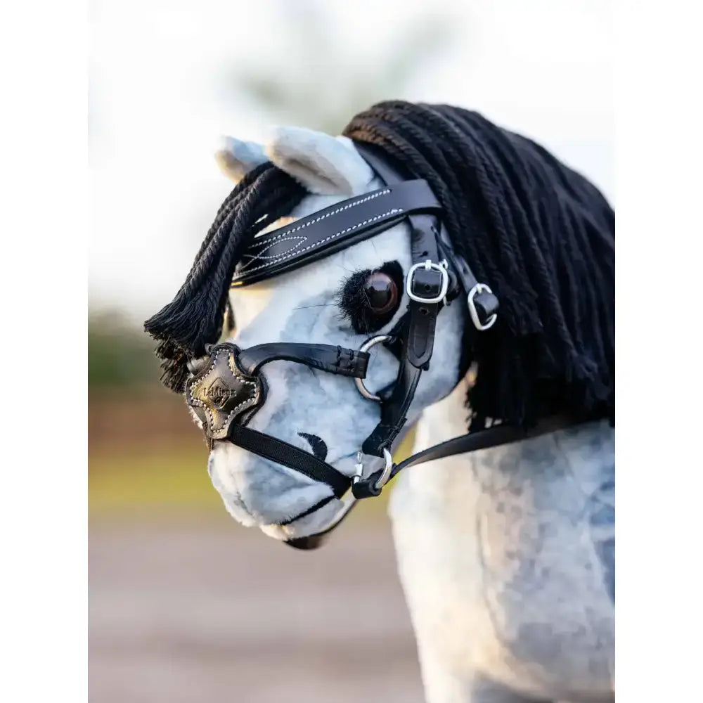 A lemieux toy pony wooden rocking horse with white gray pattern and black leather grackle bridle black and silver hardware