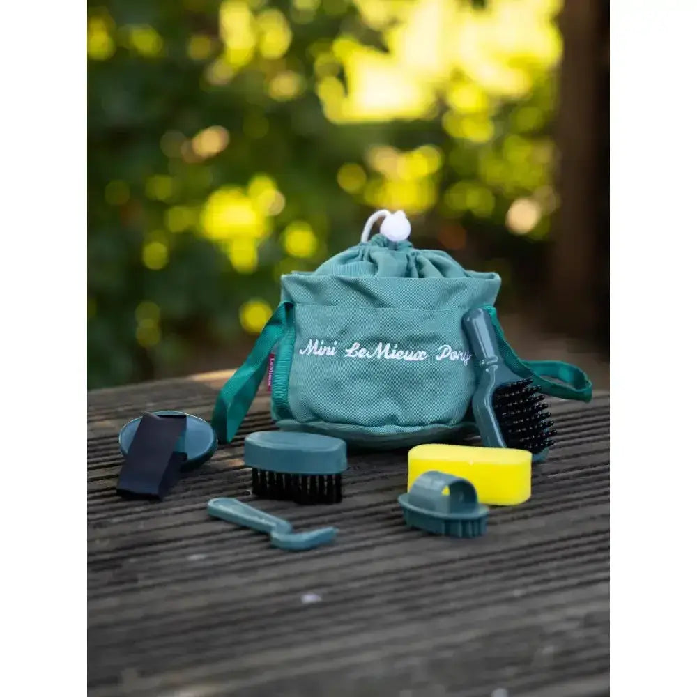 Teal lemieux toy pony drawstring bag with white embroidered text and pom-pom for pony grooming kit sage