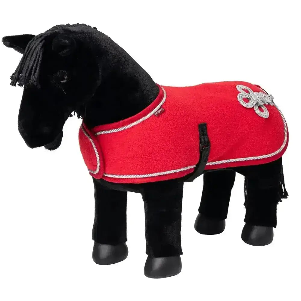 Black plush lemieux toy pony wearing a red felt pony rug chilli with white rope trim and silver flower embroidery