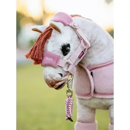 Pink plush lemieux toy pony wearing vogue headcollar and braided leadrope blossom in matching pink color