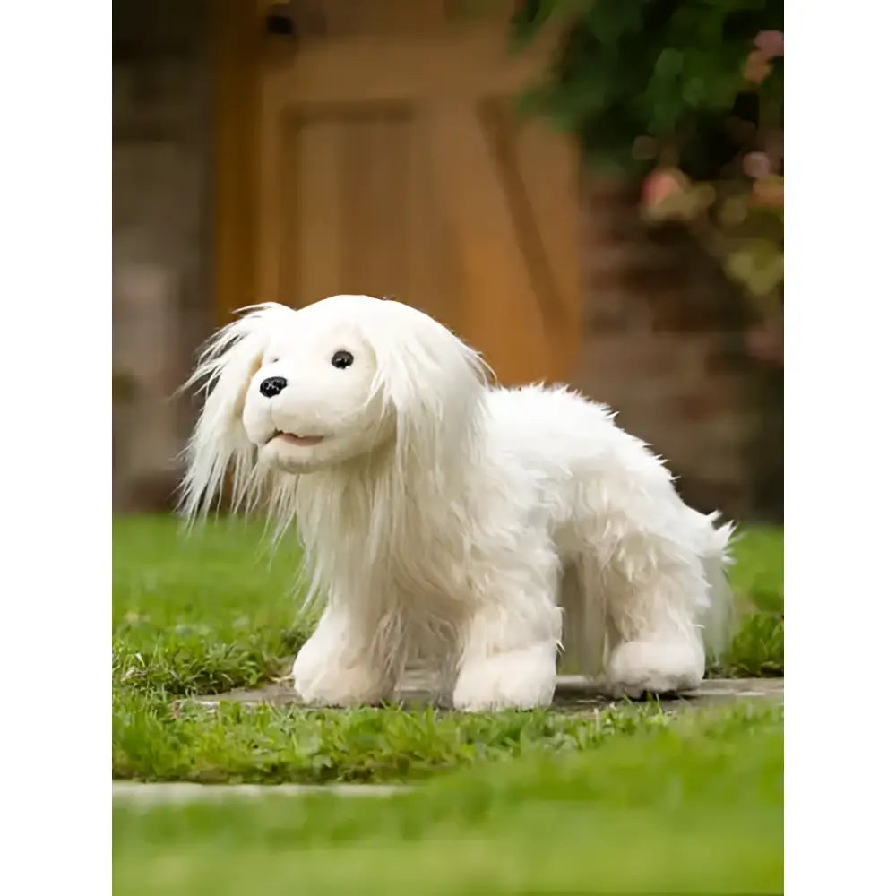 A plush white lemieux toy puppy luna with long flowing fur and black button eyes perfect for cuddling