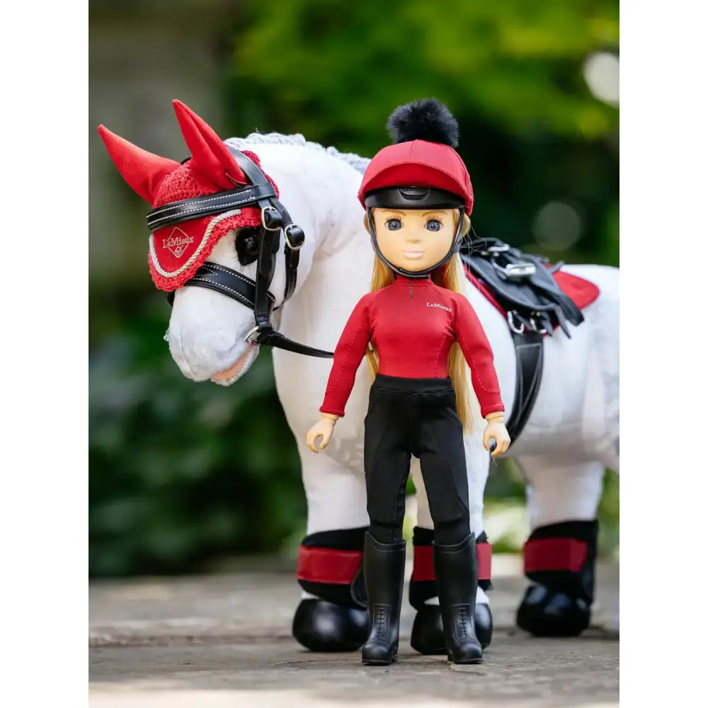 Red and black lemieux toy rider chloe doll in red helmet with black pom pom and matching riding outfit for toy pony play
