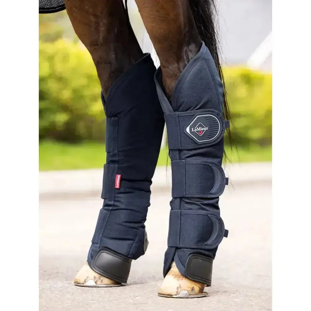 Navy blue lemieux travel boots with black reinforced sections and adjustable straps featuring lightweight breathable innovation