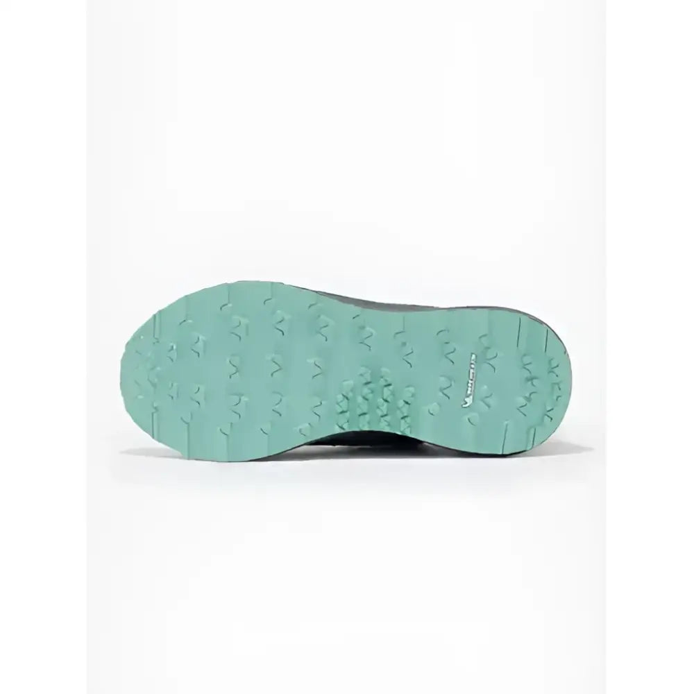 Teal rubber sole with textured star-shaped tread on the back of the lemiueux trax-lite trainer dusk for equestrian use